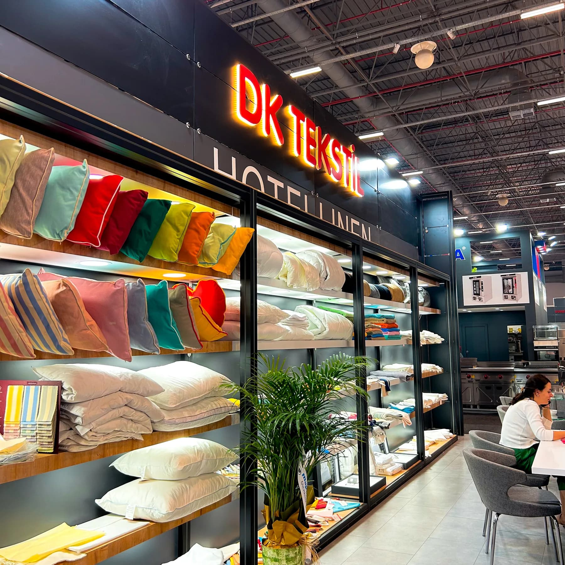 DK Tekstil — Illuminated shelving for a colourful textile collection.