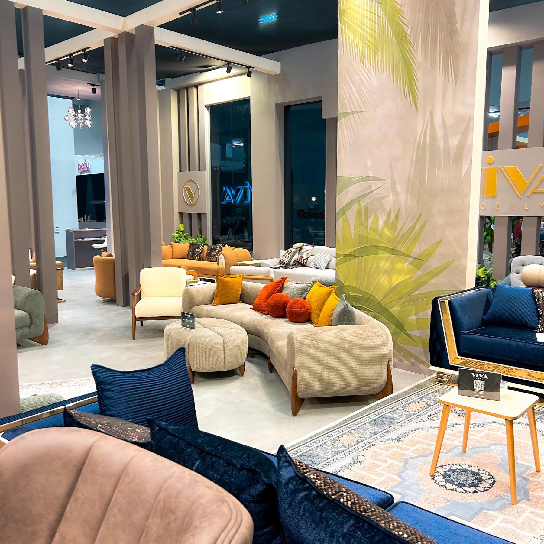 Viva Mobilya — A sequence of furnished living spaces on the exhibition floor.