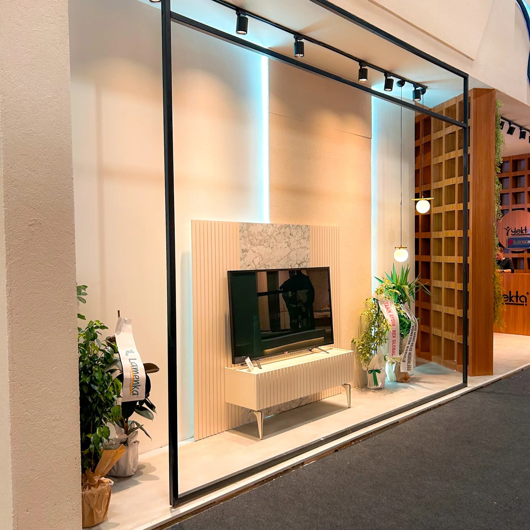Yekta — Joinery, display shelving and warm interior finishes.
