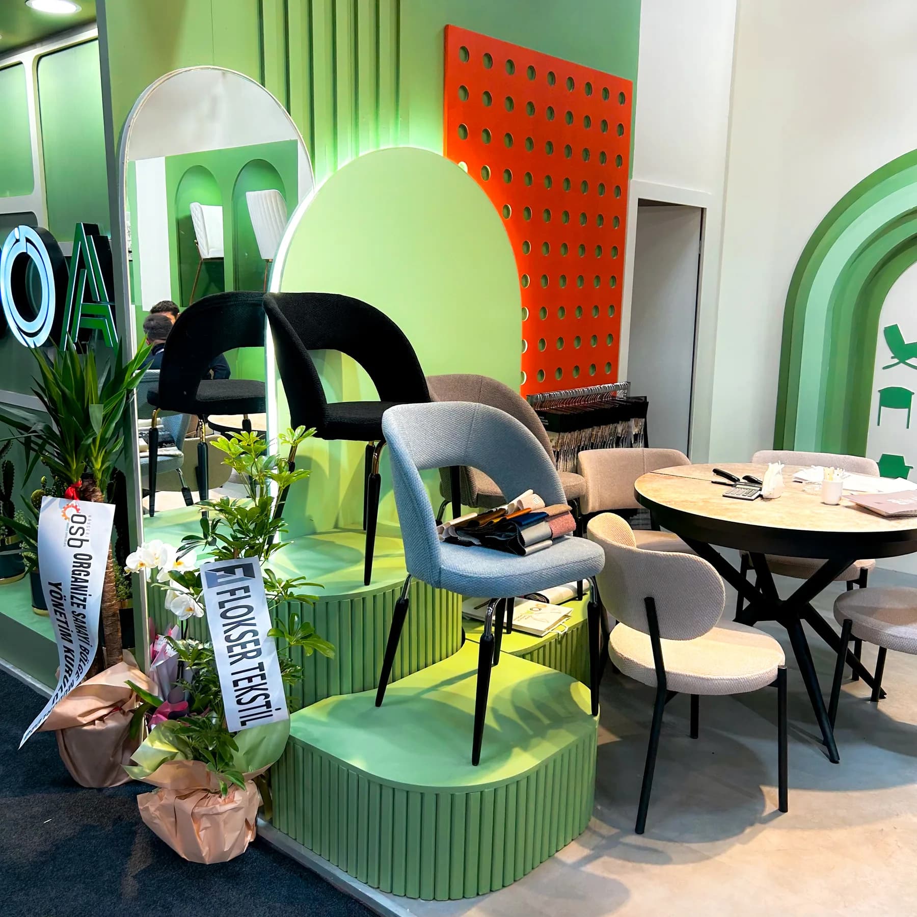DOA — Sculptural niches and a green palette for furniture displays.