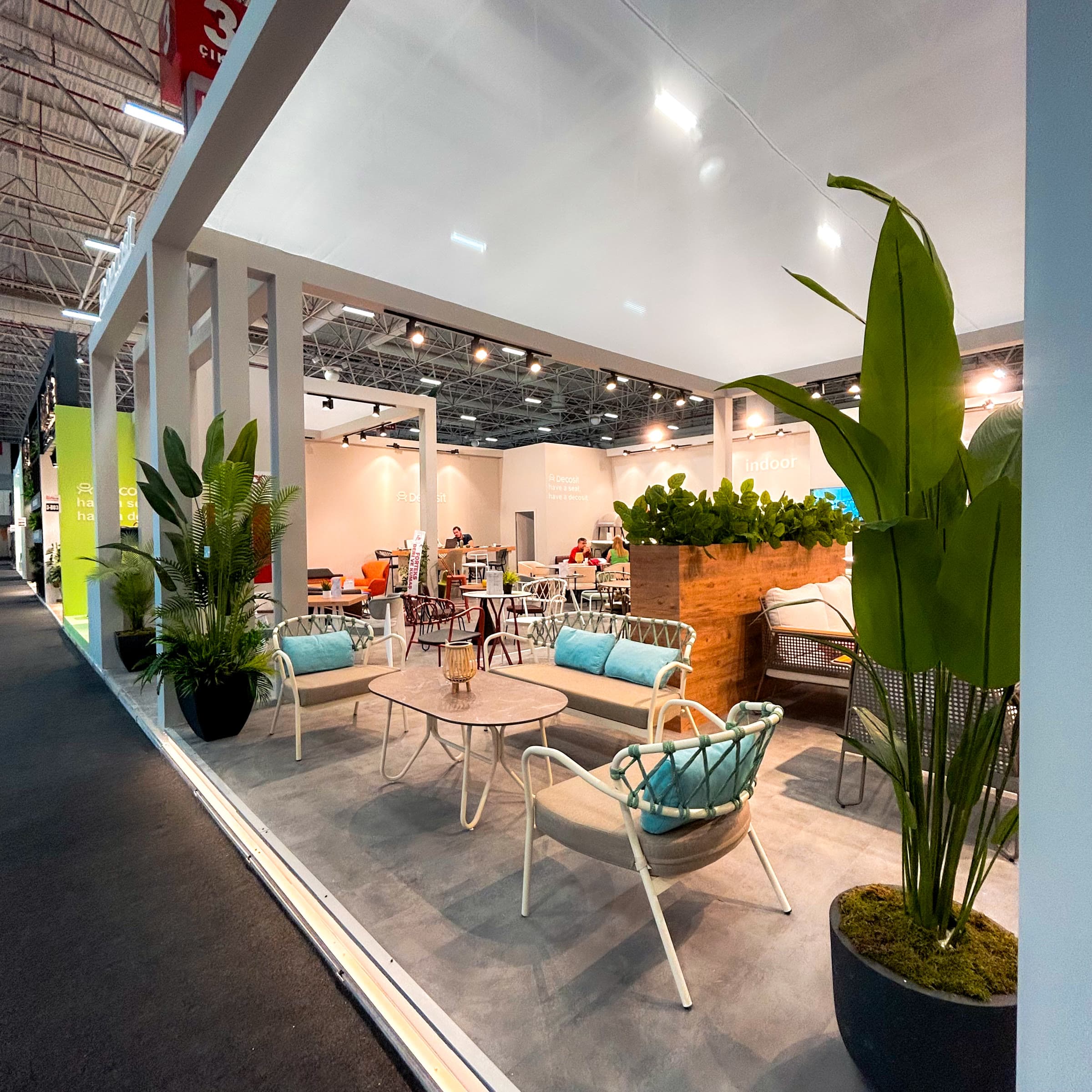 Interior lounge and living area arrangement within an exhibition stand