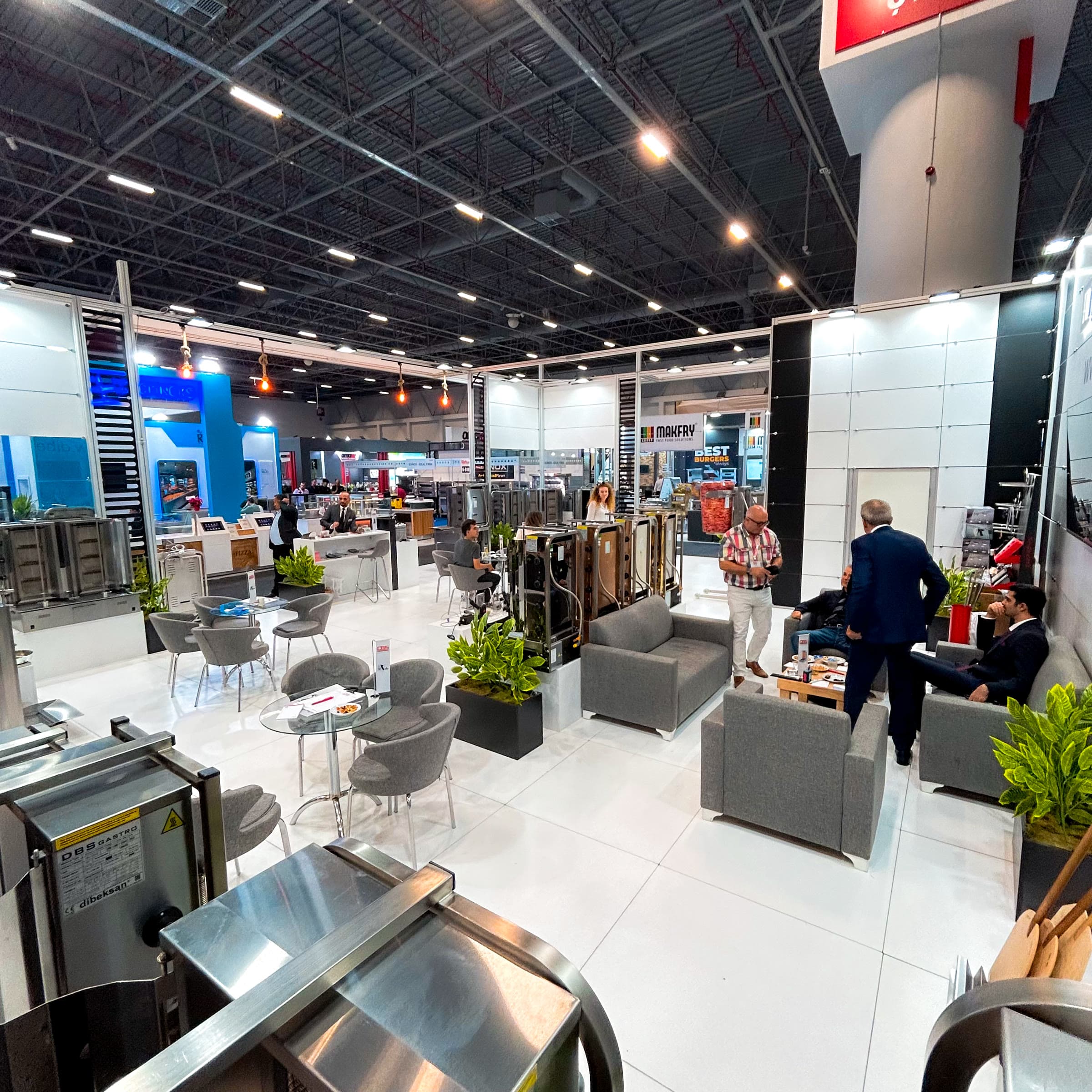Wide-angle view of stand and site operations at a gastronomy fair