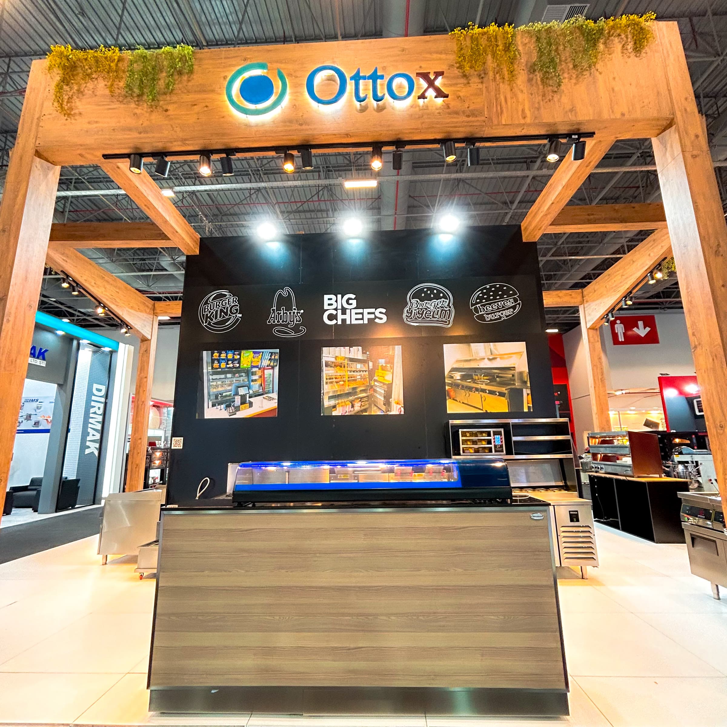 Industrial kitchen equipment exhibition stand with a wooden structural frame